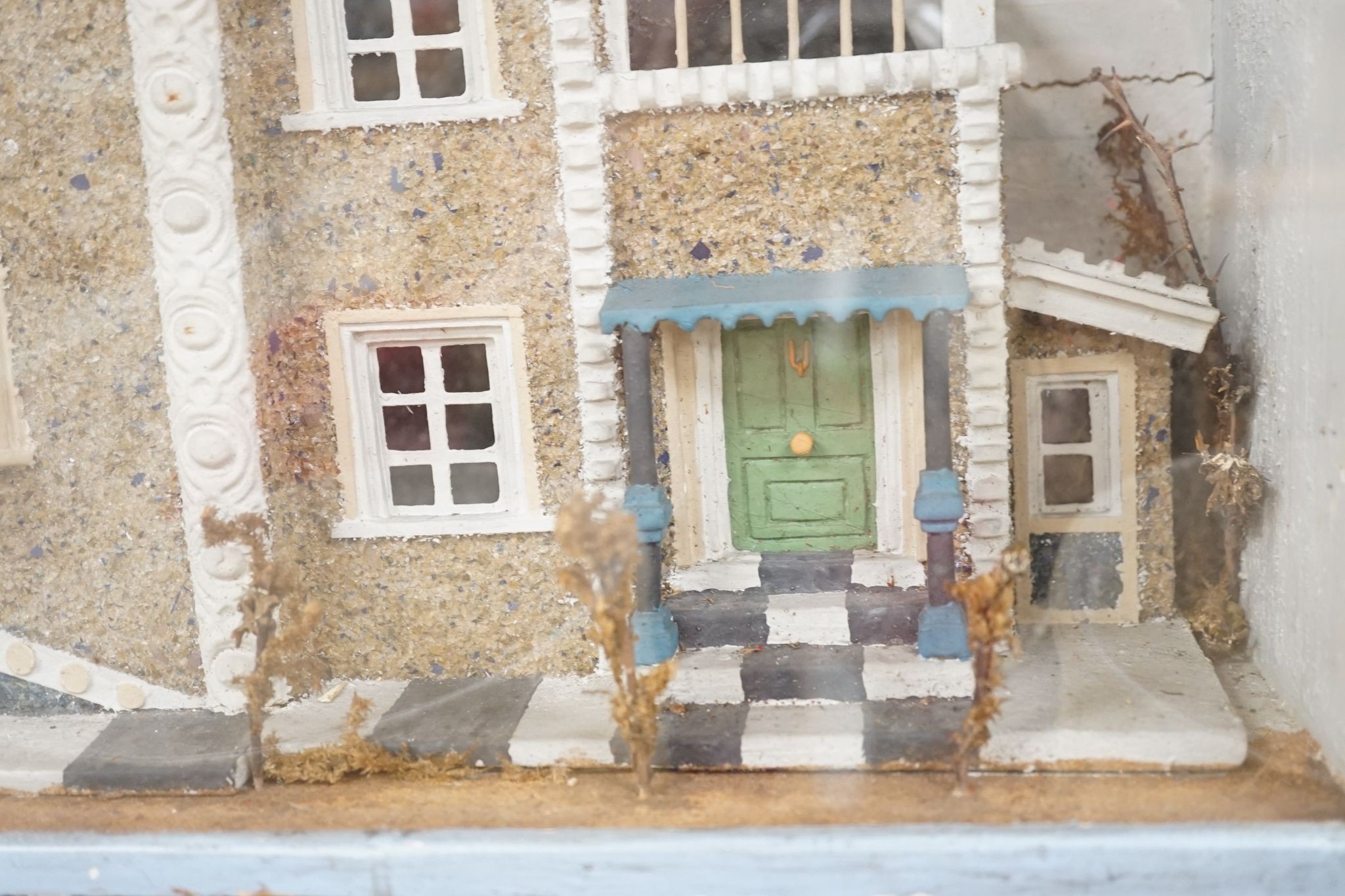 A diorama of a country house, case 63 cm wide